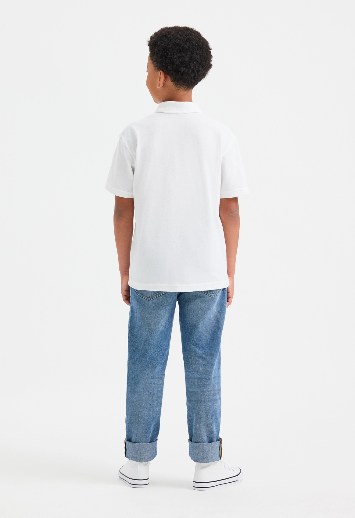 Model wearing Uneek UC103 Childrens Classic Poloshirt