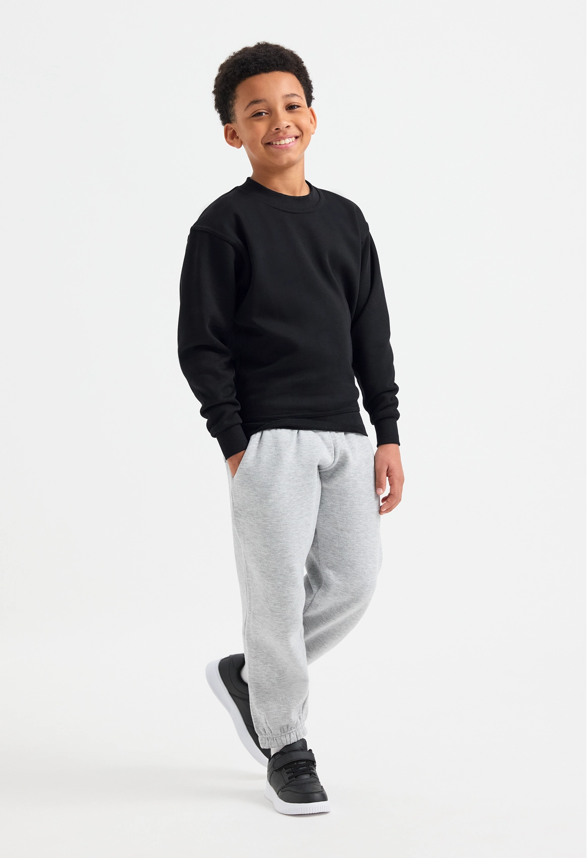 Model wearing Uneek UC202 Childrens Classic Sweatshirt
