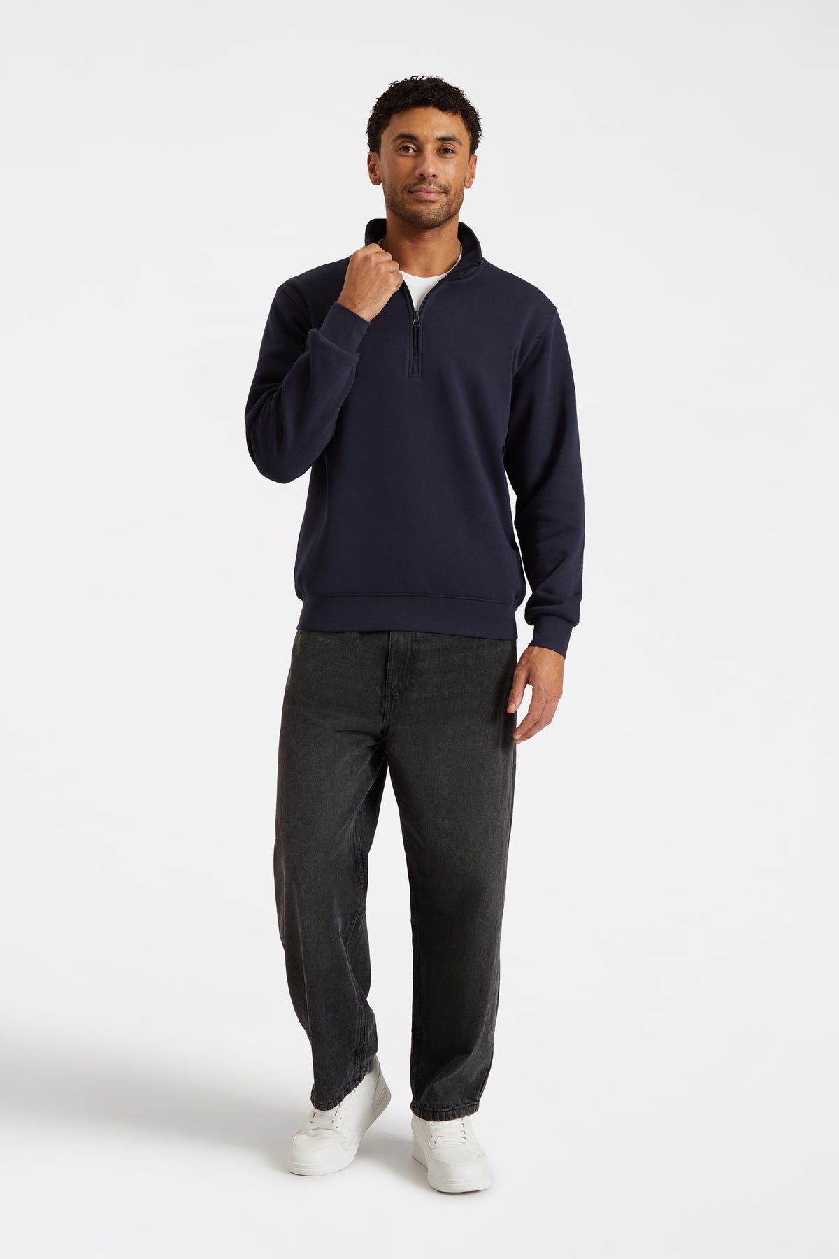 Model wearing Uneek UC213 Quarter Zip Sweatshirt