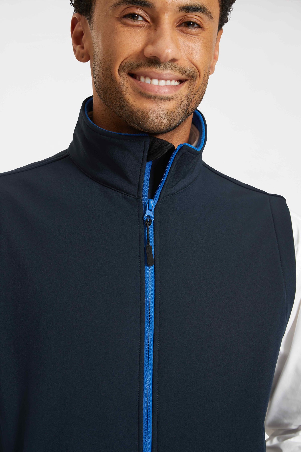 Model wearing Uneek UC614 Printable Softshell Gilet