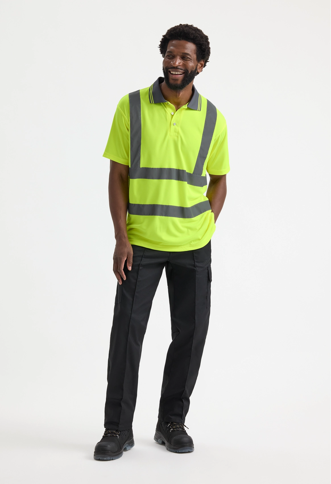 Model wearing Uneek UC808 Hi Vis Short Sleeve Polo Shirt